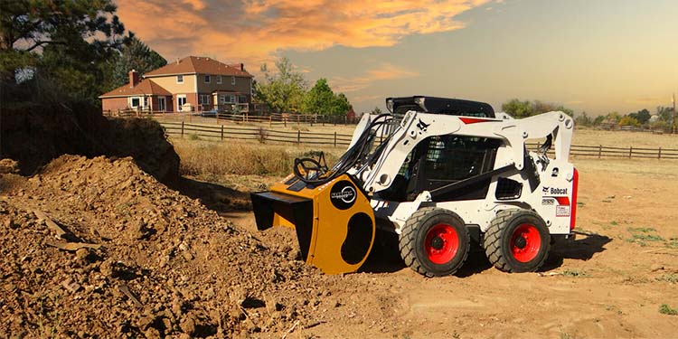 Rock Tools Screening Bucket Digging in pile of dirt on farm