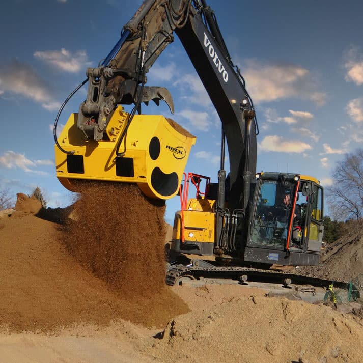 Rock Tools Screening Bucket on excavator equipment screening a pile of dirt