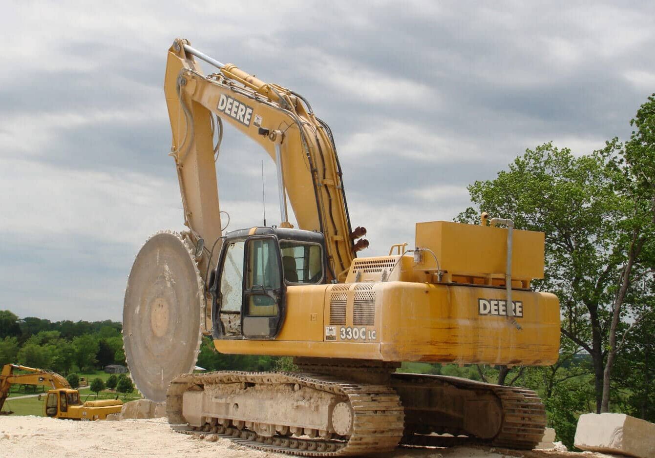 Rock Tools 8' Diameter Tungsten Carbide Saw on John Deere 330